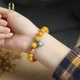 Aucini beeswax bracelet amber chicken oil yellow old wax with cloisonné enamel Ruyi pendant for men and women and Ling Yangyang Aucini beeswax bracelet amber chicken oil yellow old wax with cloisonné enamel Ruyi pendant for men and women and Ling Yangyang
