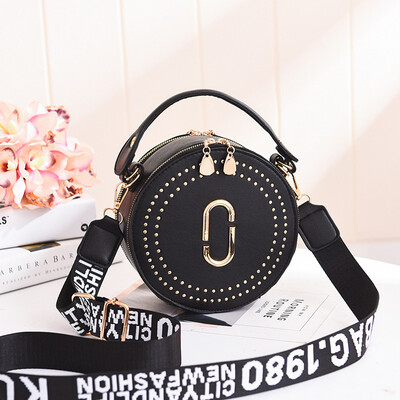 

Fashion rivet small round bag portable Korean version of the lady bag shoulder diagonal wide shoulder strap small bag
