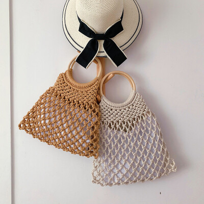 

Hand-woven woven bag female new Korean fashion hollow beach ring mother bag tide