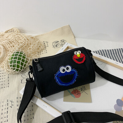 

Casual fashion ugly sesame street canvas cylinder bag female 2019 new cartoon simple versatile shoulder Messenger bag