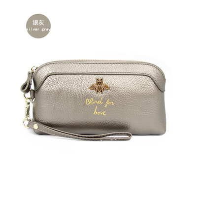 

The first layer of cowhide 2019 new ladies leather Europe&America bee bills position shell type clutch bag long wallet