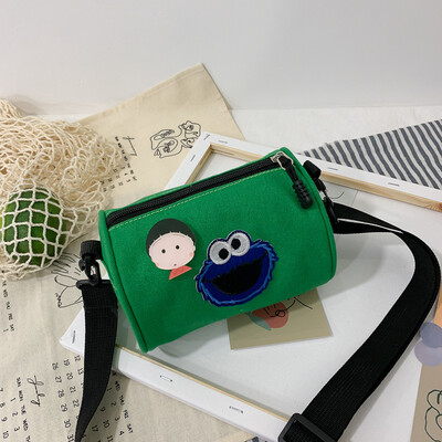 

Casual fashion ugly sesame street canvas cylinder bag female 2019 new cartoon simple versatile shoulder Messenger bag