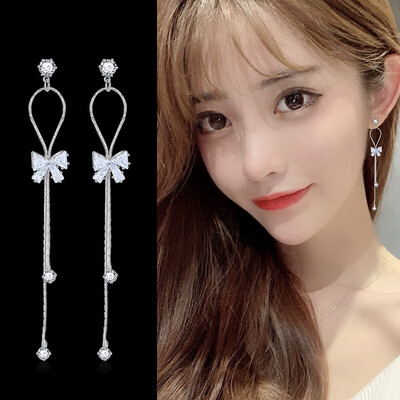 

Long fringed small bow tie earrings exaggerated wild thin face earrings Korean version of the small fresh artificial zircon ear je