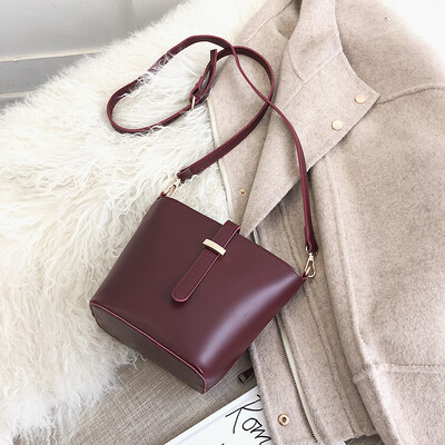 

Qiao Bani 2019 new South Korea ins fashion simple solid color pumping bucket bag shoulder diagonal trend handbags