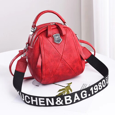 

A girl with a double shoulder bag a broadband shoulder bag a Korean version of a backpack a girl slanted a small round bag and