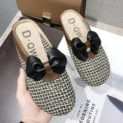 

Baotou half slippers women wear 2019 new summer hollow cute bow flat heel slippers tide