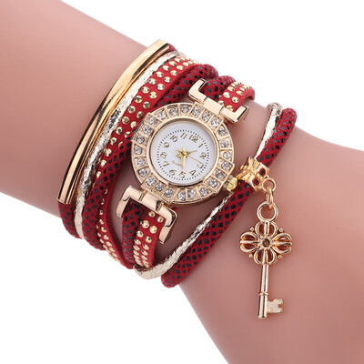 

Creative fashion ladies winding bracelet watch gold key pendant quartz watch female models explosion models