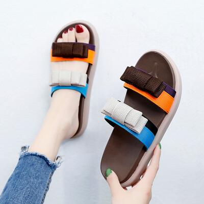 

In summer the Korean version of Joker color matching bow thick bottom slippers womens fashion wear muffin bottom word slippers
