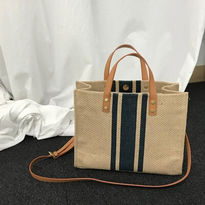 

Striped canvas handbag 2019 new shoulder bag Korean version of the tide multi-function large capacity commuter package