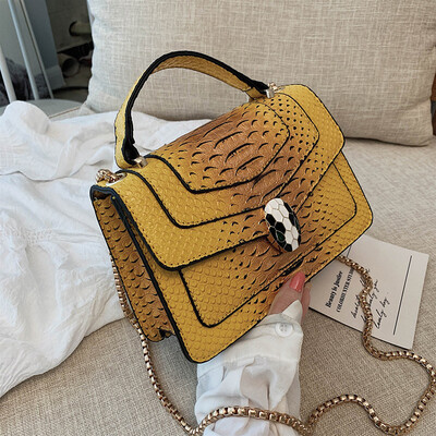 

Qiao Bani 2019 new European&American style fashion snake pattern transition color BV snake head flip cover shoulder shoulder diagonal handbag