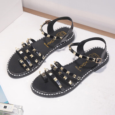 

Sandals woman summer Korean version rivets flat bottom sandals female one-toed student beach Roman shoes