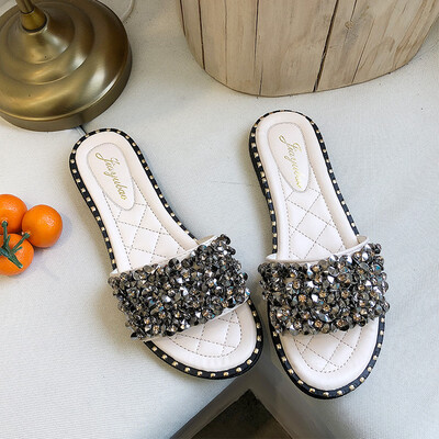 

Hong Kong wind slippers womens summer fashion outside wearing flat-bottomed sequins a word drag holiday beach shoes