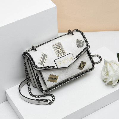 

Retro spring&summer tide woman hand-held retro badge 100 lap rivets chain single shoulder oblique satchel bag