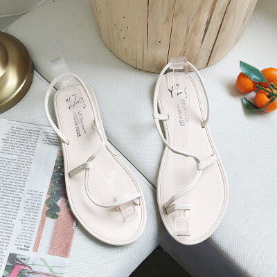 

Sandals female Xia flat-soled students simple set of toes Korean version 100 soft sister beach vacation Roman shoe girl