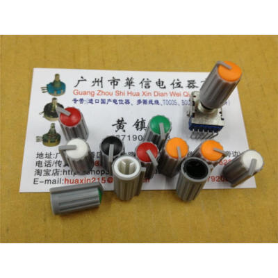 

Tuning potentiometer knob axle cap colored red orange . Black . Thick stripes green body