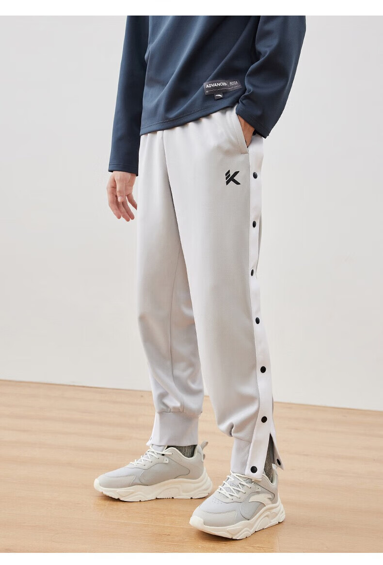 安踏(anta) kt运动文化裤丨运动裤男冬季排扣热身训练球裤扯裤宽松