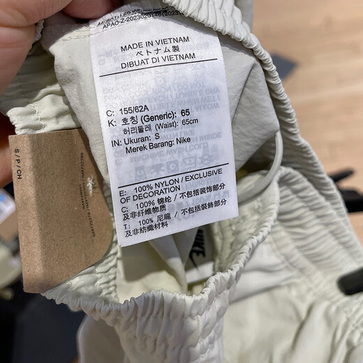 Nike (Nike) Pantalon féminin, shorts d'entraînement, pantalon de sport de nouveau style d'été, entraînement de course, fitness, pantalon à cinq points en baisse et décontracté FV6623-020 gris et blanc L