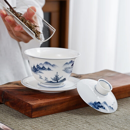 Gold-inlaid jade covered bowl tea set Kung Fu teacup set mutton-fat jade ceramic hand-painted landscape household simple three pieces close to mountains and rivers