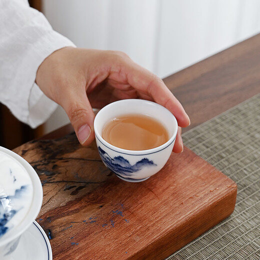 Gold-inlaid jade covered bowl tea set Kung Fu teacup set mutton-fat jade ceramic hand-painted landscape household simple three pieces close to mountains and rivers
