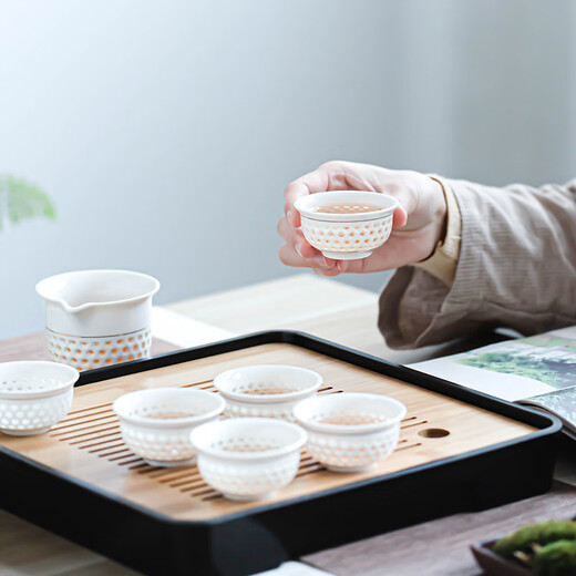 Craftsman's exquisite ceramic tea set complete set of honeycomb hollow tureen simple household kung fu small teapot office tea cup set <Sunflower> 10-piece tureen set