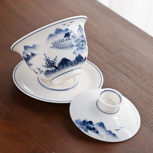 Gold-inlaid jade covered bowl tea set Kung Fu teacup set mutton-fat jade ceramic hand-painted landscape household simple three pieces close to mountains and rivers