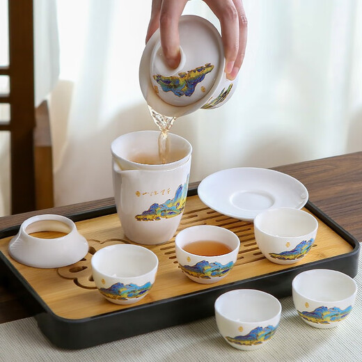 Three more than nine such as Kung Fu tea set complete gift box to give away mutton-fat jade tea set high-end travel tea tray teacup cover bowl integrated mutton-fat jade tea set blue leather bag