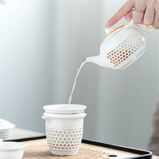 Craftsman's exquisite ceramic tea set complete set of honeycomb hollow tureen simple household kung fu small teapot office tea cup set <Sunflower> 10-piece tureen set