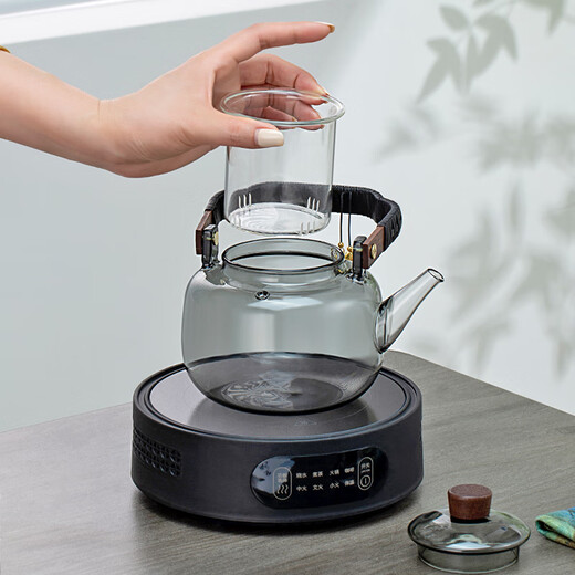 Gold inlaid jade tea making set, electric ceramic stove, glass tea kettle, tea making set, household fully automatic tea making around the stove, leaves start to fall