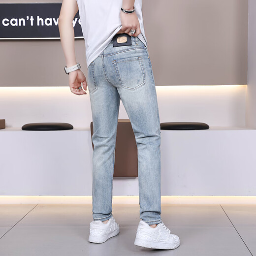 Le nouveau jean déchiré de Gezan, la marque de mode fine de la marque élastique, la couleur claire élastique des pantalons longs haut de gamme pour hommes, le bleu clair 9887 36 (2 pieds 8)