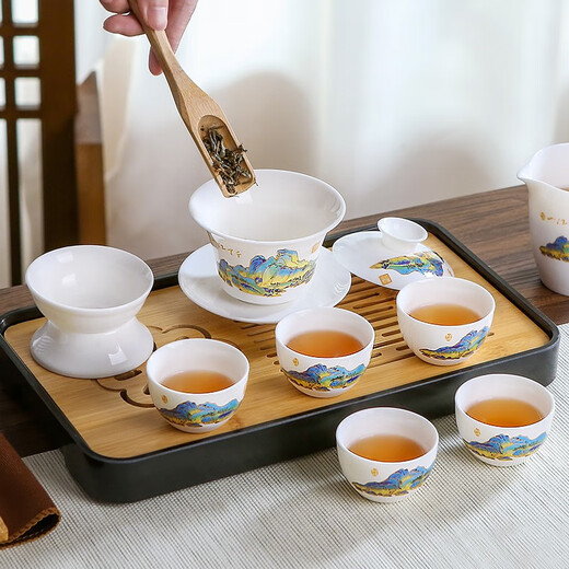 Three more than nine such as Kung Fu tea set complete gift box to give away mutton-fat jade tea set high-end travel tea tray teacup cover bowl integrated mutton-fat jade tea set blue leather bag