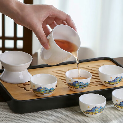 Three more than nine such as Kung Fu tea set complete gift box to give away mutton-fat jade tea set high-end travel tea tray teacup cover bowl integrated mutton-fat jade tea set blue leather bag