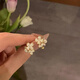 Xingluo Xueluo Gardenia pure white flower ear clips for women without piercing earrings for women sweet temperament painless mosquito coil ear clips a pair of mosquito coil ear clips (without pierced ears)