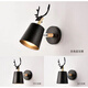 Yilin Nordic simple desk wall lamp bedroom bedside lamp living room corridor wall lamp macaron personalized creative deer head lamp black three-color light