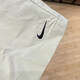 Nike (Nike) Pantalon féminin, shorts d'entraînement, pantalon de sport de nouveau style d'été, entraînement de course, fitness, pantalon à cinq points en baisse et décontracté FV6623-020 gris et blanc L