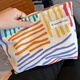 Ins niche canvas bag contrasting color striped cosmetic bag portable travel business trip skin care product storage bag wash bag colorful striped cosmetic bag