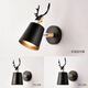Yilin Nordic simple desk wall lamp bedroom bedside lamp living room corridor wall lamp macaron personalized creative deer head lamp black three-color light