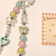 Beiyipin's new mobile phone ornament, fresh love bow, beads bracelet ins style mobile phone accessories, wristband, ornament chain, anti-lost and anti-lost mobile phone chain
