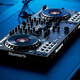 Numark/Luma NS4FX four-channel DJ controller box commercial performance DJ player Serato Lite dark gray
