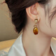 Ji Yuyou Clear Amber Maillard Earrings Women's High-Quality Light Luxurious Temperament Earrings Autumn and Winter Earrings 2025 New Amber