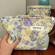 025 new yellow background purple flower niche cosmetic bag portable skin care product collection yellow background purple flower cosmetic bag