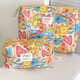Cross-border Kasuga Graffiti cosmetic bag for traveling, portable storage toiletry bag, quilted large-capacity handbag, Kasuga Graffiti clutch bag