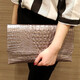 Sac enveloppe Woodpecker (Tucano) pour les femmes 2025 Nouvelle-européenne et américaine Modèle de mode Tempérament pour femmes Tempérament Hands Sacle Single Single épaule Crossbody Band Black