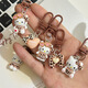
Leopard print cartoon KT keychain brown autumn and winter retro cat school bag pendant ins style sweet cool hanging decoration cute glasses sitting-light leopard print KT