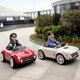 Kangshuai Aibeimei children's electric car, four-wheeled, can be made into a human, with remote control, can be driven, a toddler toy car, 1-5 years old, electric car for children, standard white, hard seat + remote control + 12V4A + trunk