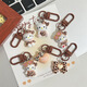
Leopard print cartoon KT keychain brown autumn and winter retro cat school bag pendant ins style sweet cool hanging decoration cute glasses sitting-light leopard print KT