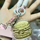 Lao Fengxiang 999 Mobiltelefonbeutel Anhänger Milk Tee Burger Pommes Valentinstag Geschenk Mobiltelefone Geburtstags Geschenk Milch Tee 20 mg+ Zertifikat/KT -Katze Geschenkbox