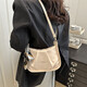 Frauen 2025 Frühling neuer modischer faltiger Umhängetaschen Vielseitige Crossbody -Tasche Mode Achselhöhlen -Tasche 6252 Weiß