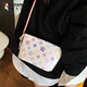 Woodpeckers beliebte Tasche für Frauen in diesem Jahr 2025 Neue Sommer vielseitige Nische Crossbody Tasche Super heiß bedruckte Eimerbeutel braune Farbe + Anhänger