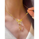 Feng Feili Fugitive Princess Clavicle Chain 2025 New Bow Tassel Necklace for Women 18K Gold Gold Bead Butterfly Tassel Necklace