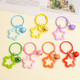 Colorful five-pointed star acrylic keychain pendant, dopamine color earphone case pendant, couple bag decoration, 1 color star keychain (random color)